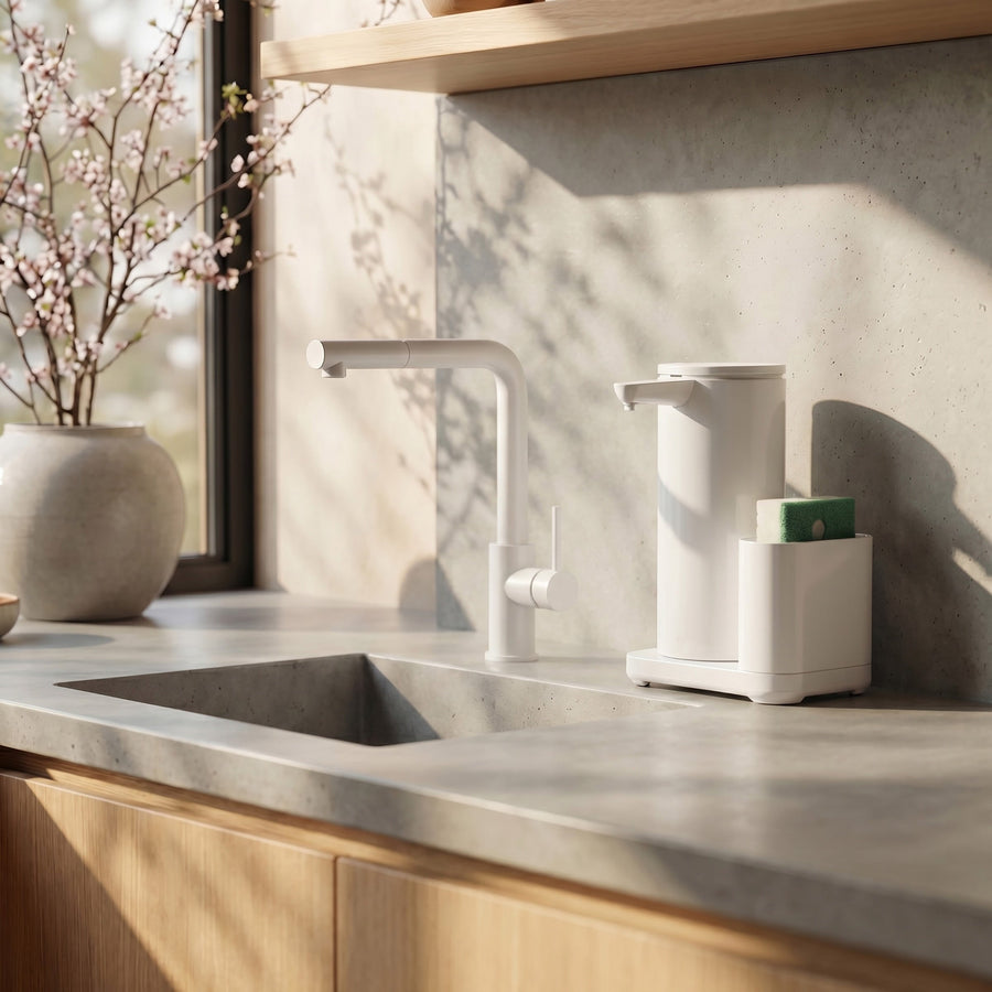 Simplehuman's 14 oz. Liquid Sensor Pump with Caddy in White in a modern kitchen setting with granite countertop and wall including wooden cabinets.