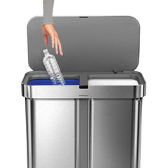 58L dual compartment rectangular sensor bin with voice and motion control - brushed finish - lifestyle hand with bottle main image